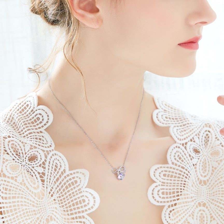 Elegance in Crystal Bows Earrings and Necklace Set